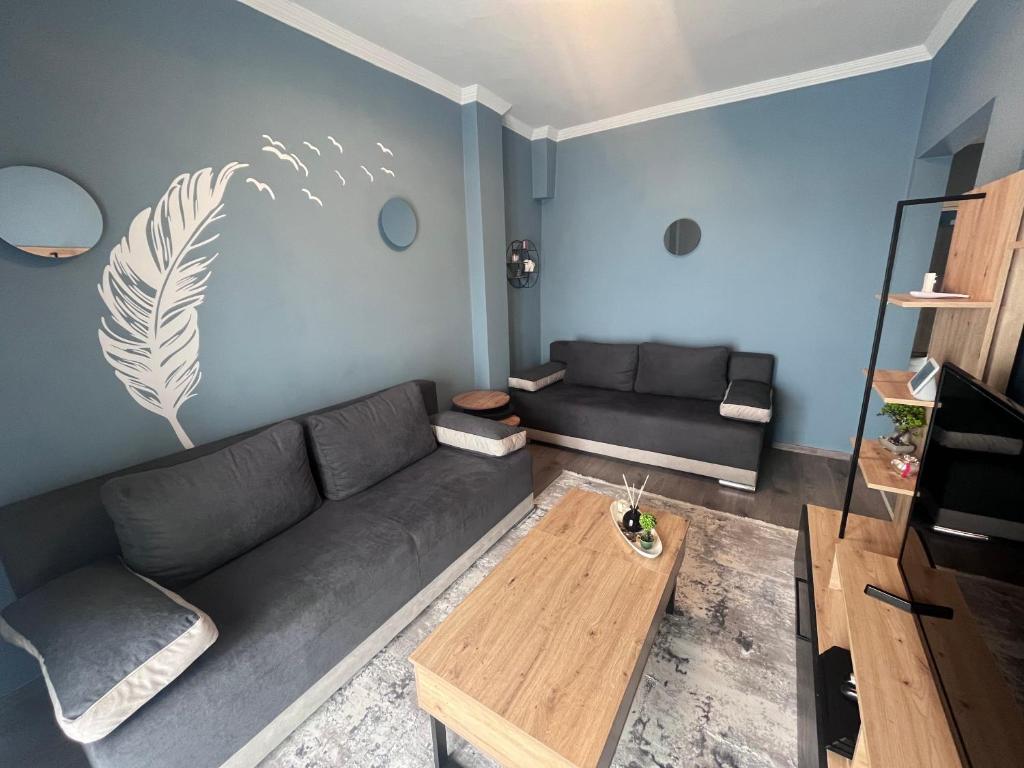 a living room with a couch and a coffee table at Casa Kleisoura in Klisoúra