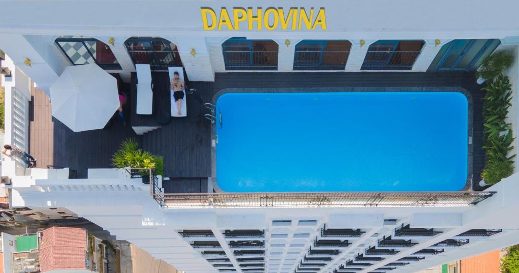 a large blue sign on the side of a building at Daphovina Hotel in Nha Trang