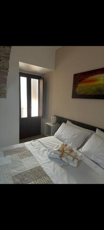 Postel nebo postele na pokoji v ubytování KALGHEROS Luxury Rooms