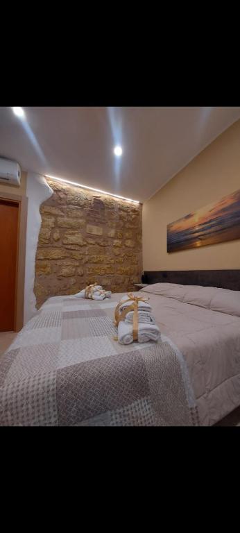 Postel nebo postele na pokoji v ubytování KALGHEROS Luxury Rooms