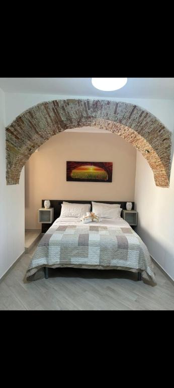 Postel nebo postele na pokoji v ubytování KALGHEROS Luxury Rooms