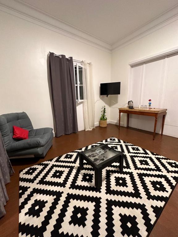 a living room with a black and white rug at Quiet studio in downtown in Cairo