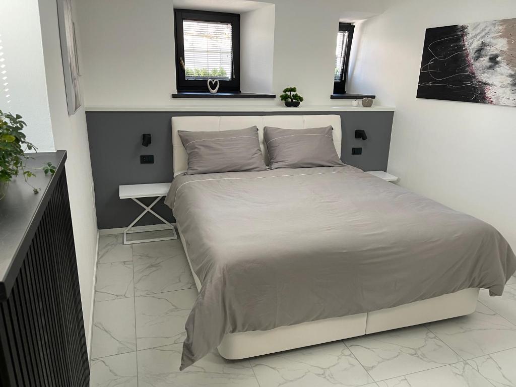 Postel nebo postele na pokoji v ubytování Apartment Aria