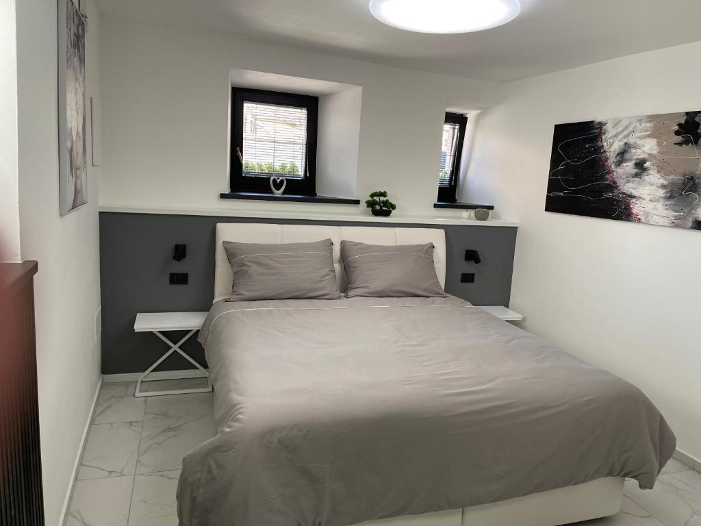 Postel nebo postele na pokoji v ubytování Apartment Aria