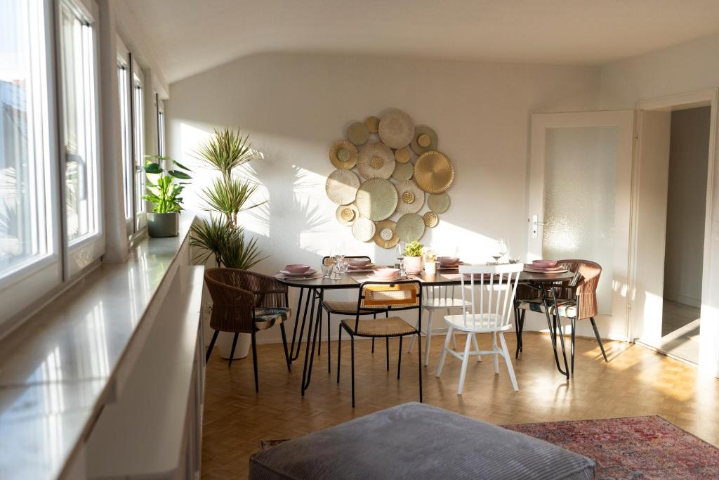 a dining room with a table and chairs at Seerose - W14 in Ulm