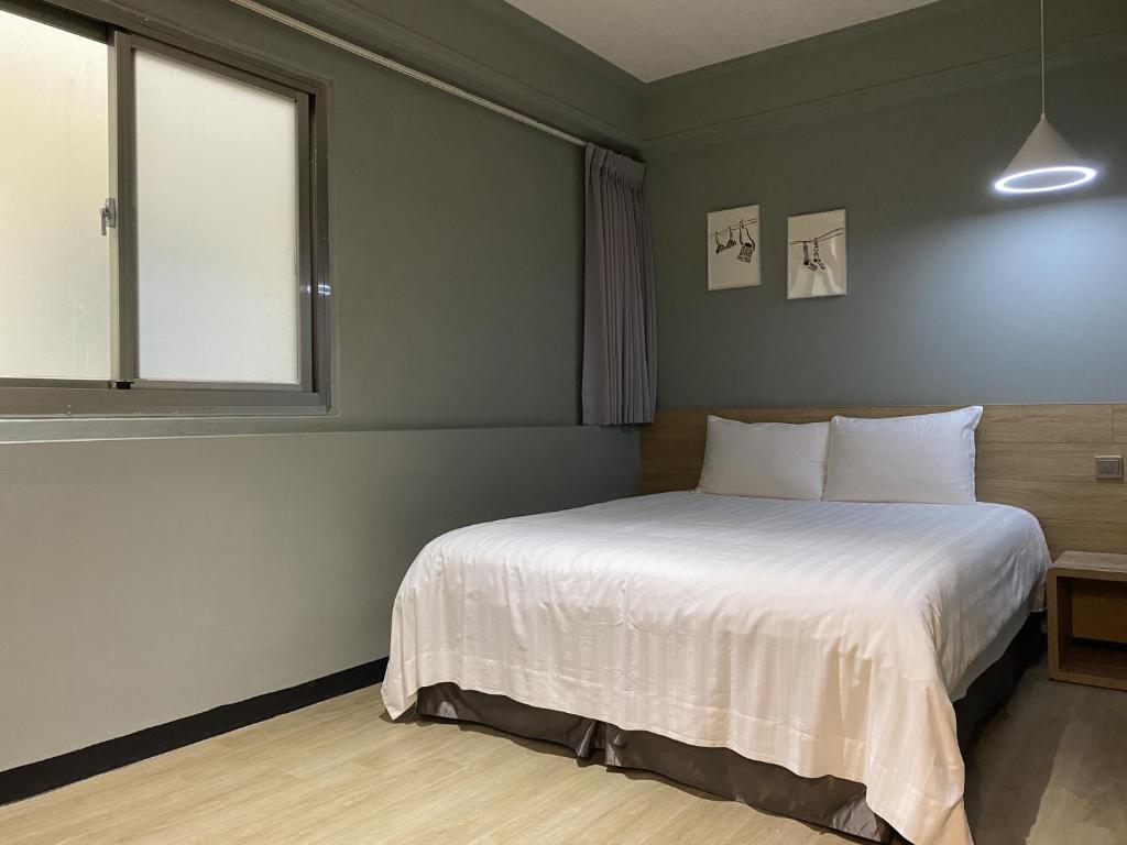 Postel nebo postele na pokoji v ubytování Prince Hotel