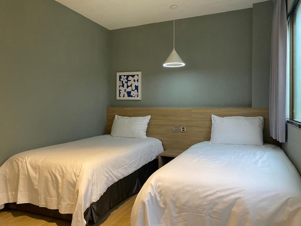 Postel nebo postele na pokoji v ubytování Prince Hotel