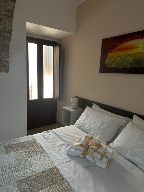 Postel nebo postele na pokoji v ubytování KALGHEROS Luxury Rooms