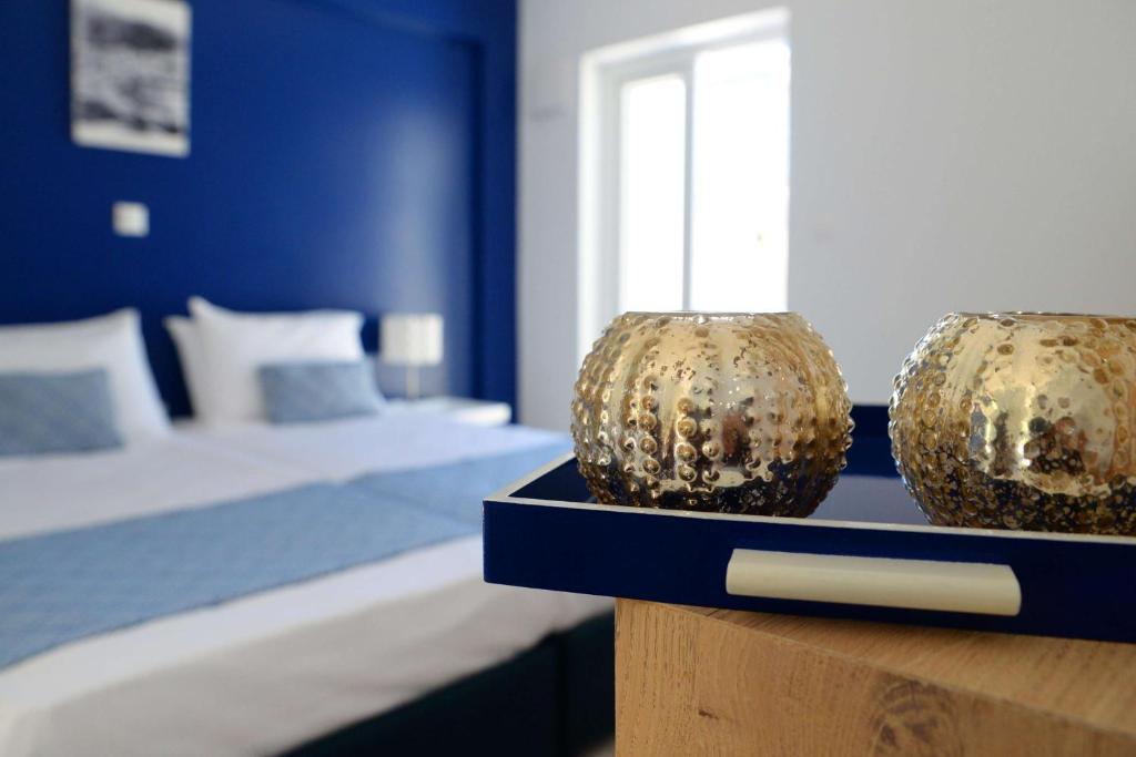 Postel nebo postele na pokoji v ubytování Aphrodite Studios Kalymnos