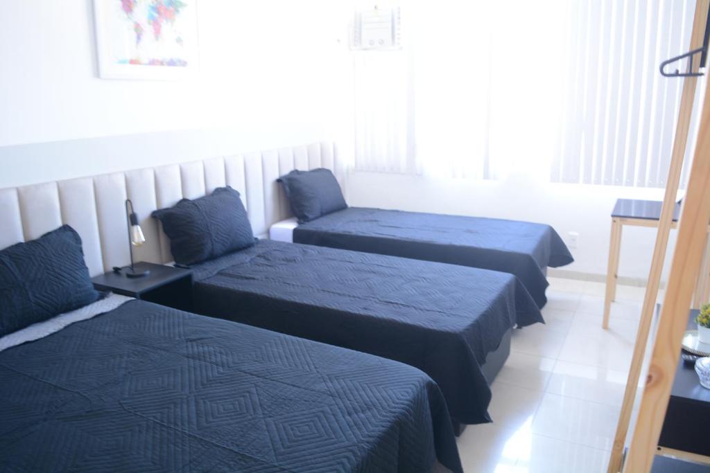 Cama ou camas em um quarto em Home Rio