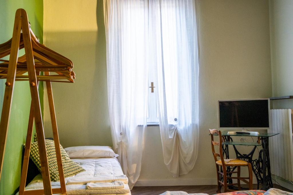 Postel nebo postele na pokoji v ubytování L'eco della rosa