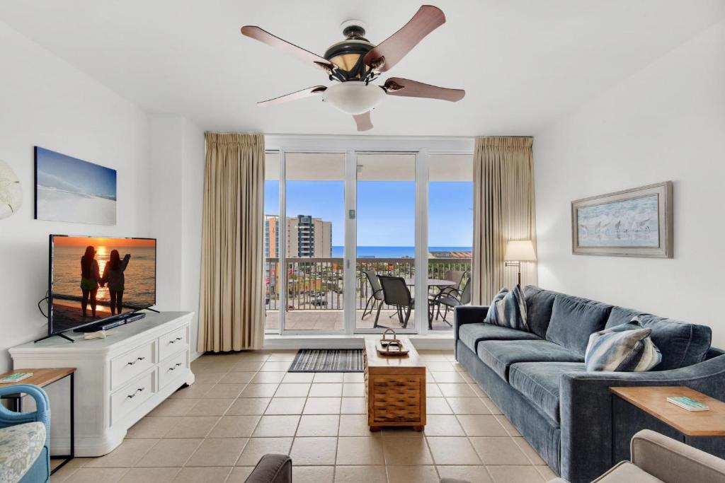 a living room with a couch and a ceiling fan at St. Lucia 704 in Destin