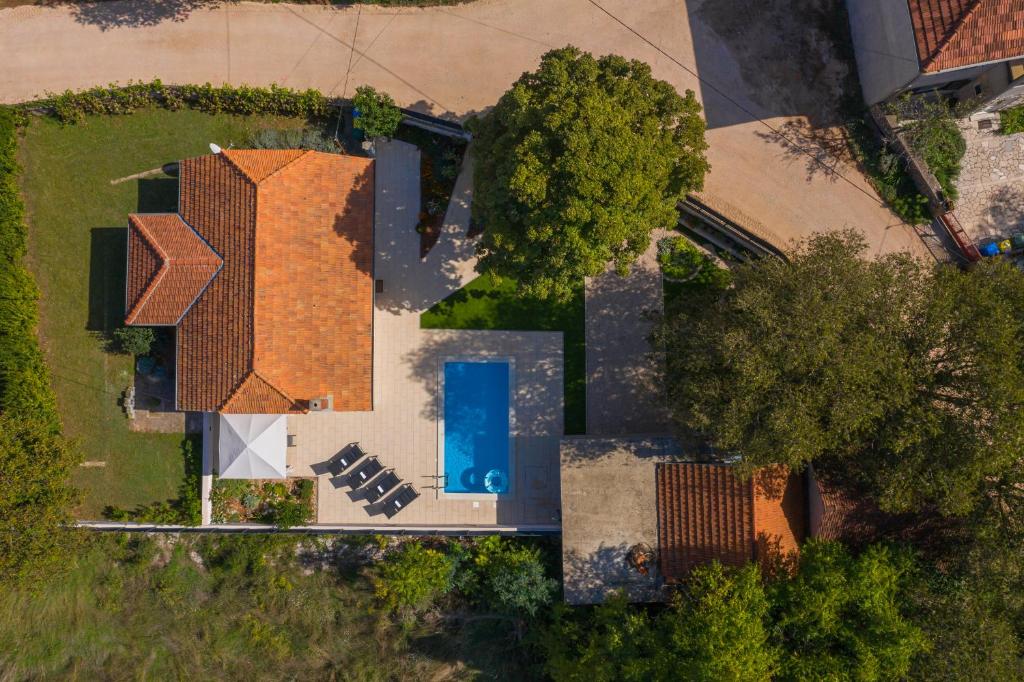 an overhead view of a house with a pool at Experience VILLAGE LIFE - Jokini Dvori with private pool in Pakovo Selo