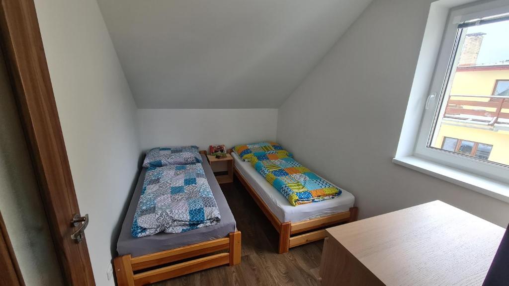 Postel nebo postele na pokoji v ubytování Apartmán Malá Valaška