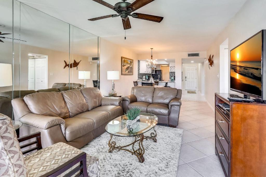 a living room with a couch and a table at Land's End 3-404 Bay Front in St Pete Beach