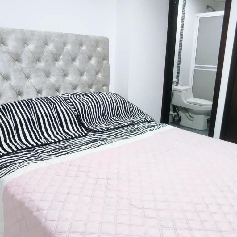 Postel nebo postele na pokoji v ubytování Privado y fascinante Apartaestudio San Alonso
