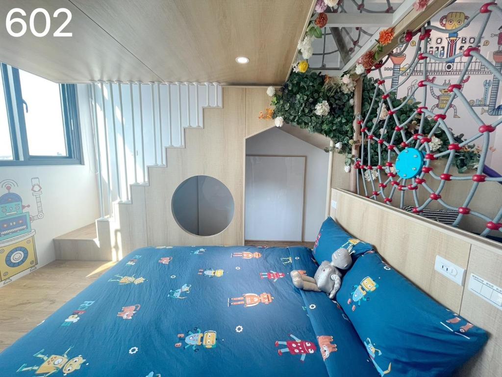 Postel nebo postele na pokoji v ubytování Wind Natural Parent-child Inn