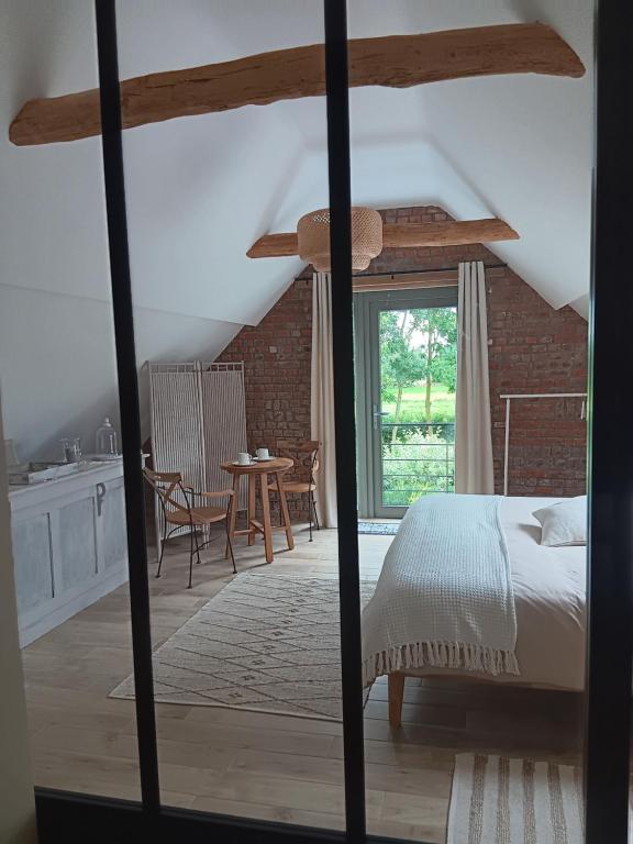 Postel nebo postele na pokoji v ubytování La chambre des daines