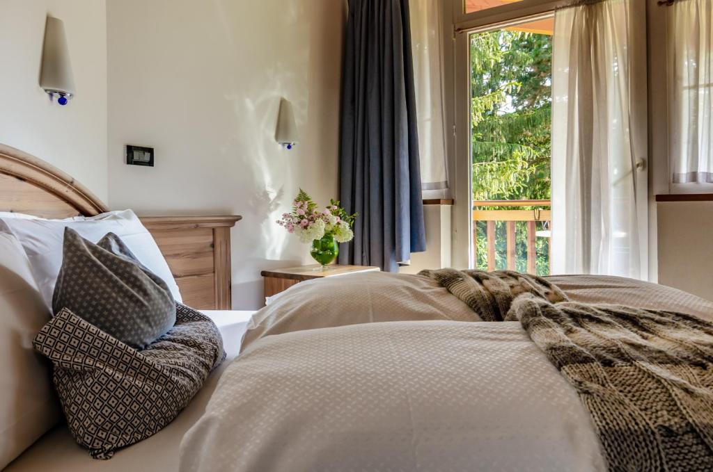 Posteľ alebo postele v izbe v ubytovaní Hotel Bella di Bosco