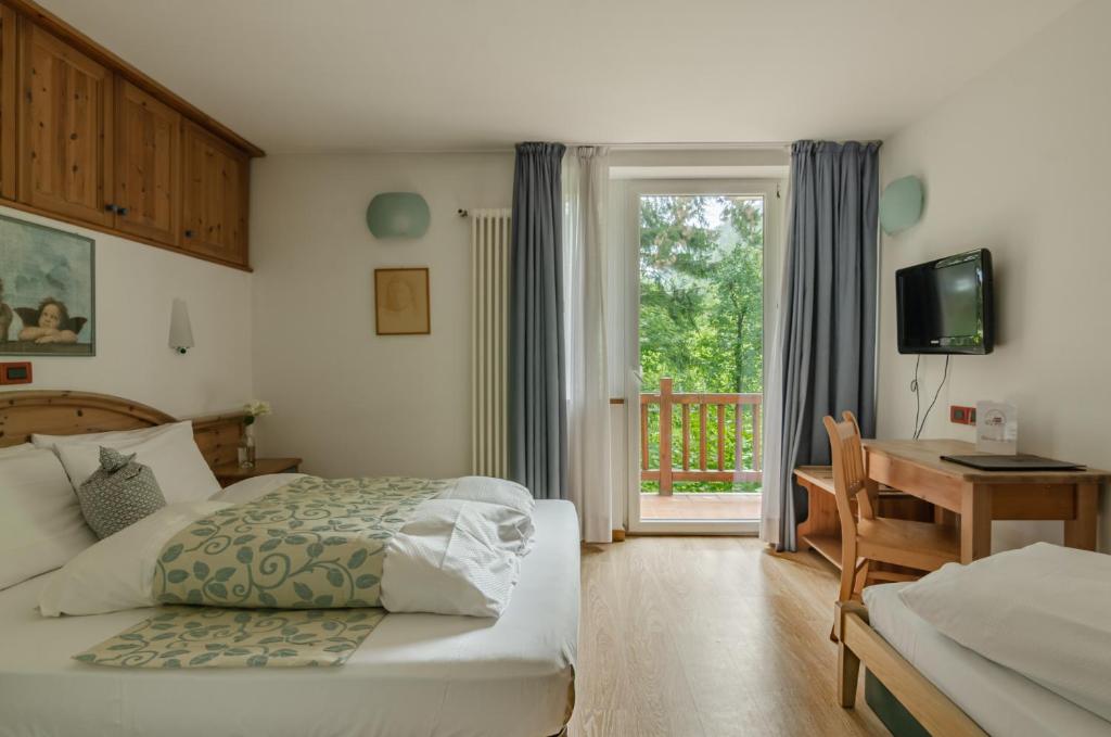 Posteľ alebo postele v izbe v ubytovaní Hotel Bella di Bosco