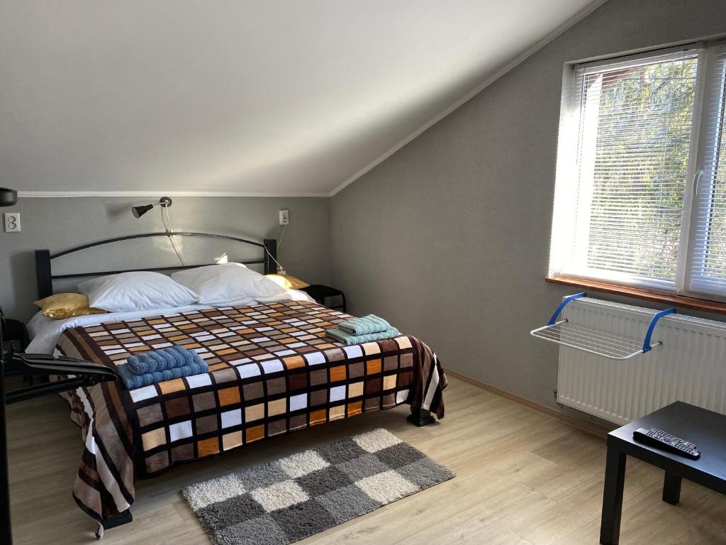 Postel nebo postele na pokoji v ubytování Mini-Hotel Serpanok