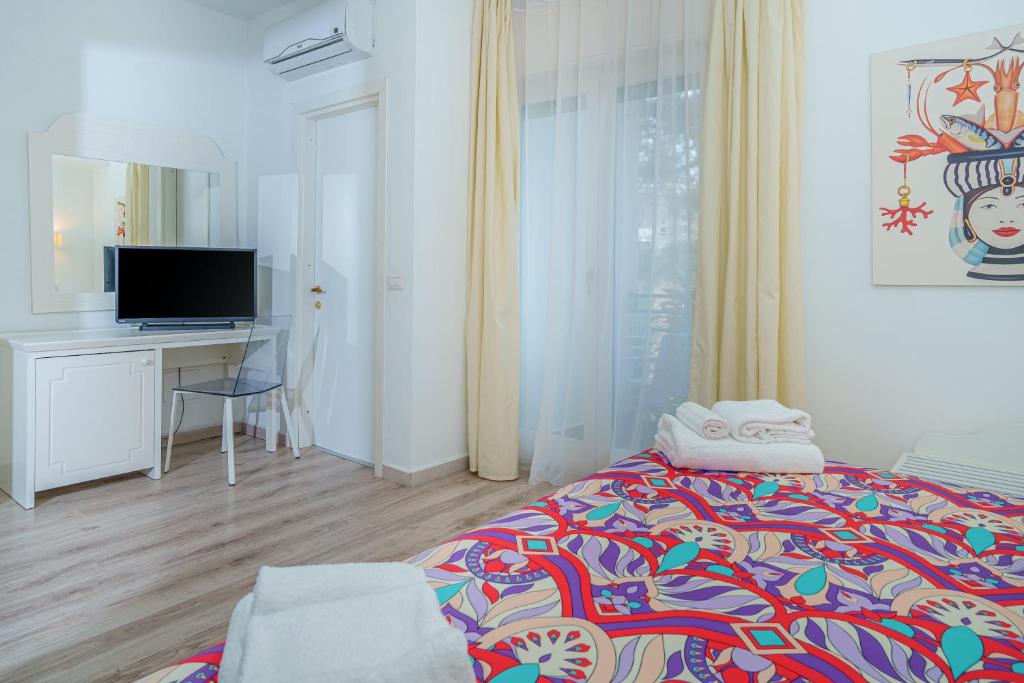 Postel nebo postele na pokoji v ubytování Hotel Oriente