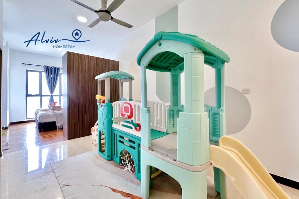a toy train on a slide in a room at Silverscape - Luxury 3-4BR with Bathtub I 6-11pax I Infinity Pool I JonkerSt - Managed by Alviv Homestay in Melaka
