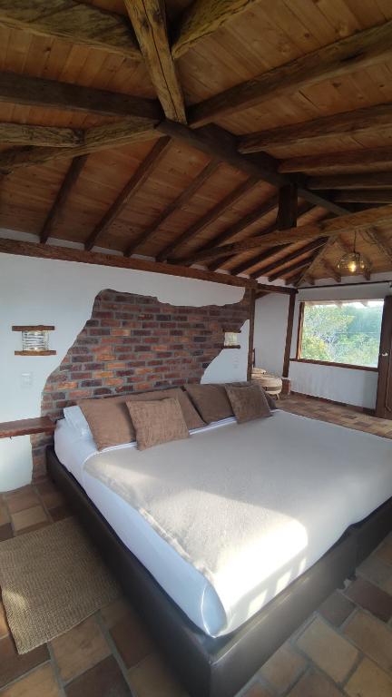Llit o llits en una habitació de Hotel Boutique Santa Clara Mesa de los Santos