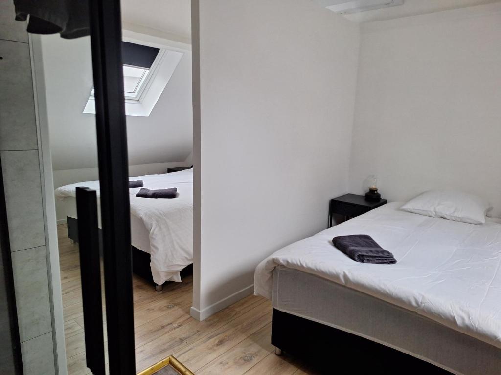 Postel nebo postele na pokoji v ubytování Huis ALNA 4