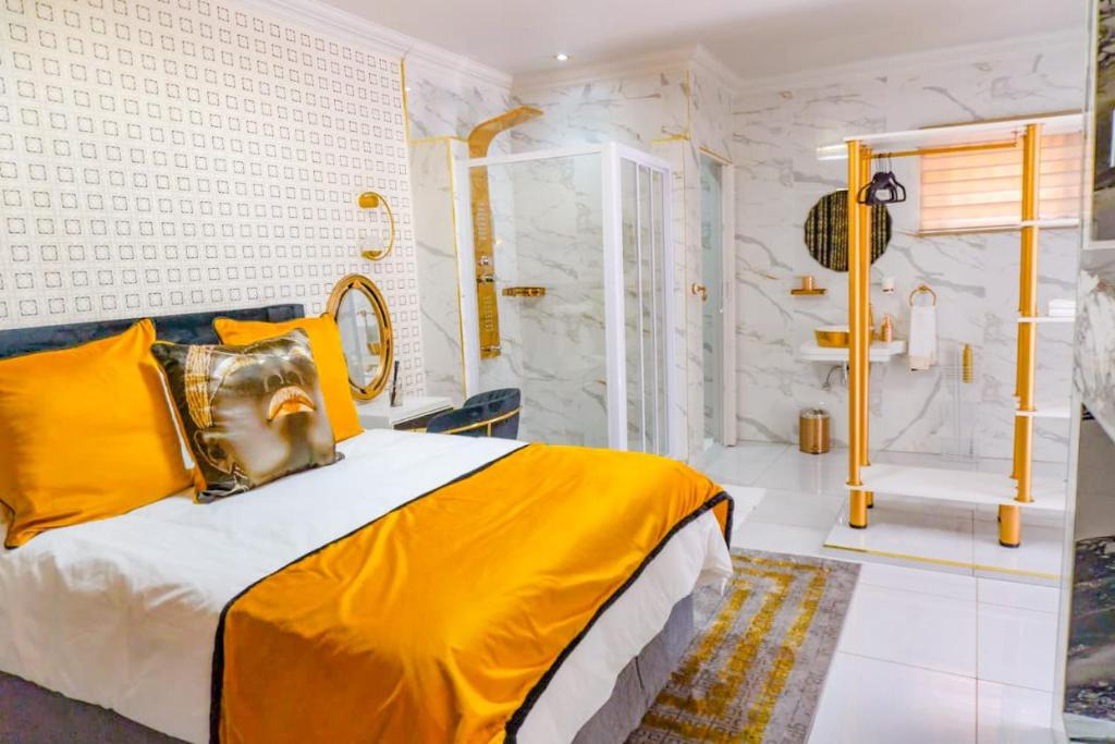 a bedroom with a king sized bed and a shower at Homes of Ace Diamond in Pretoria