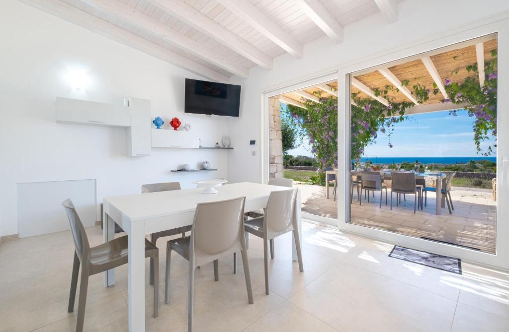 A television and/or entertainment centre at Villa Falcone - Luxury Pool Sea View