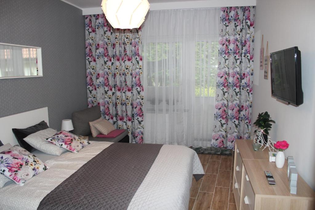 Posteľ alebo postele v izbe v ubytovaní Sunny Adventure Baltic Apartament
