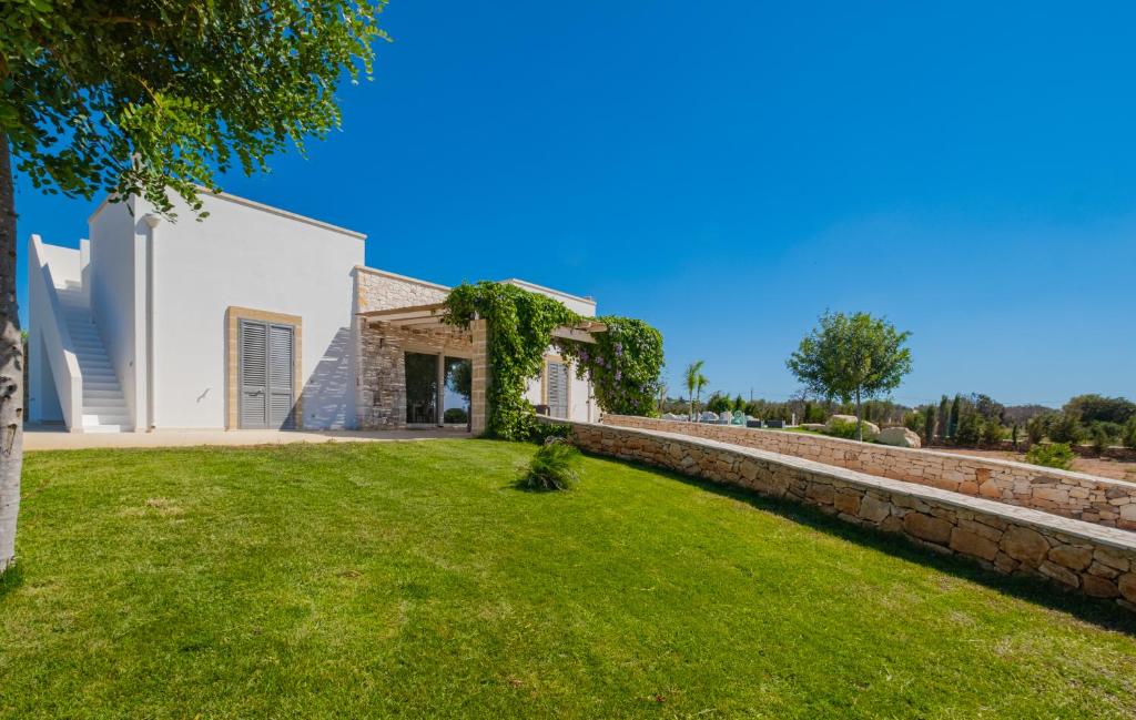 A garden outside Villa Falcone - Luxury Pool Sea View