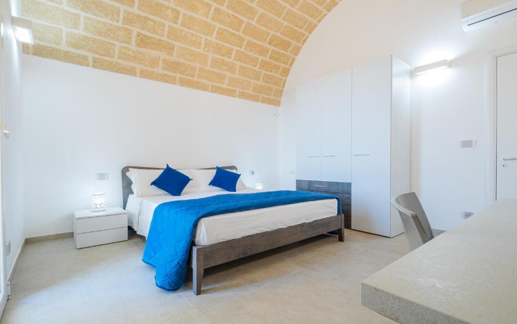 A bed or beds in a room at Villa Falcone - Luxury Pool Sea View