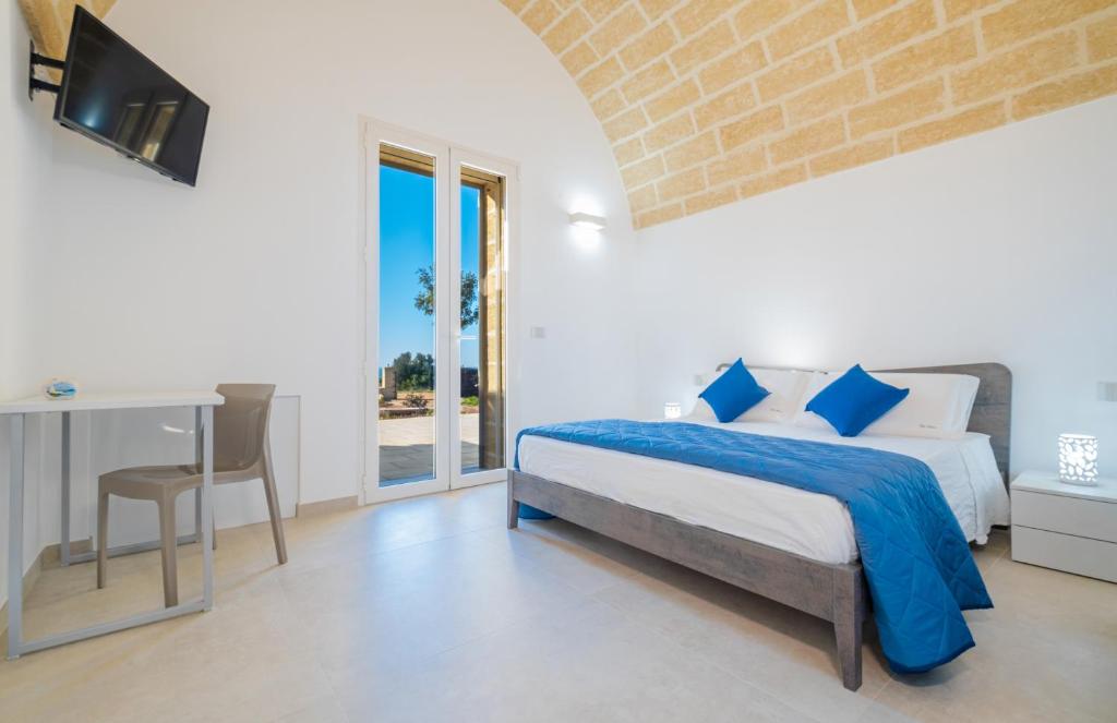 A bed or beds in a room at Villa Falcone - Luxury Pool Sea View