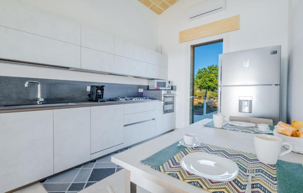 A kitchen or kitchenette at Villa Falcone - Luxury Pool Sea View