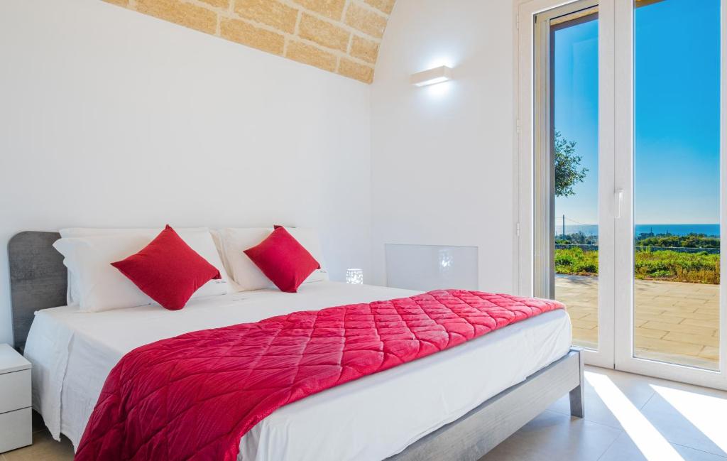 A bed or beds in a room at Villa Falcone - Luxury Pool Sea View