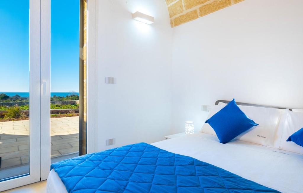 A bed or beds in a room at Villa Falcone - Luxury Pool Sea View