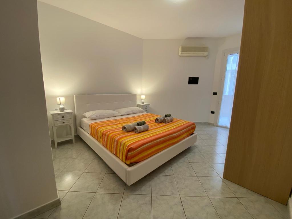 Postel nebo postele na pokoji v ubytování Alghero Lido Apartment