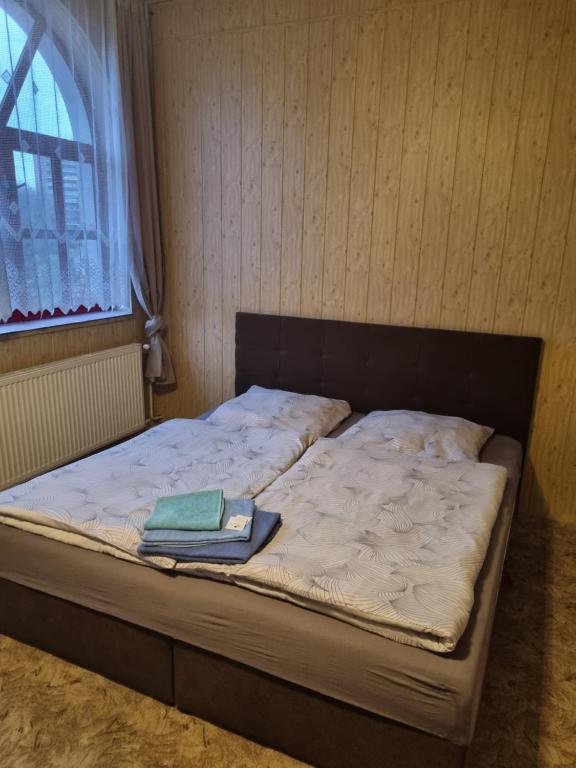 Postel nebo postele na pokoji v ubytování Studánka