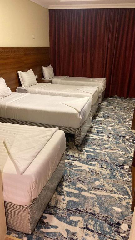 Postel nebo postele na pokoji v ubytování Hotel Abdelmalek Al Azizia