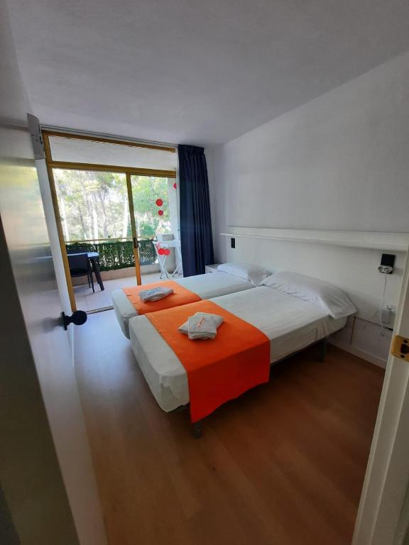 Postel nebo postele na pokoji v ubytování la casita de salou