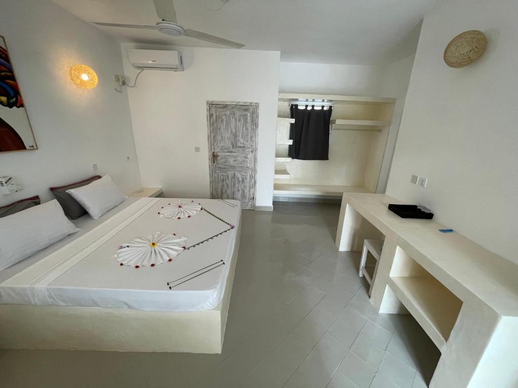Postel nebo postele na pokoji v ubytování Watamu Ascot Resort