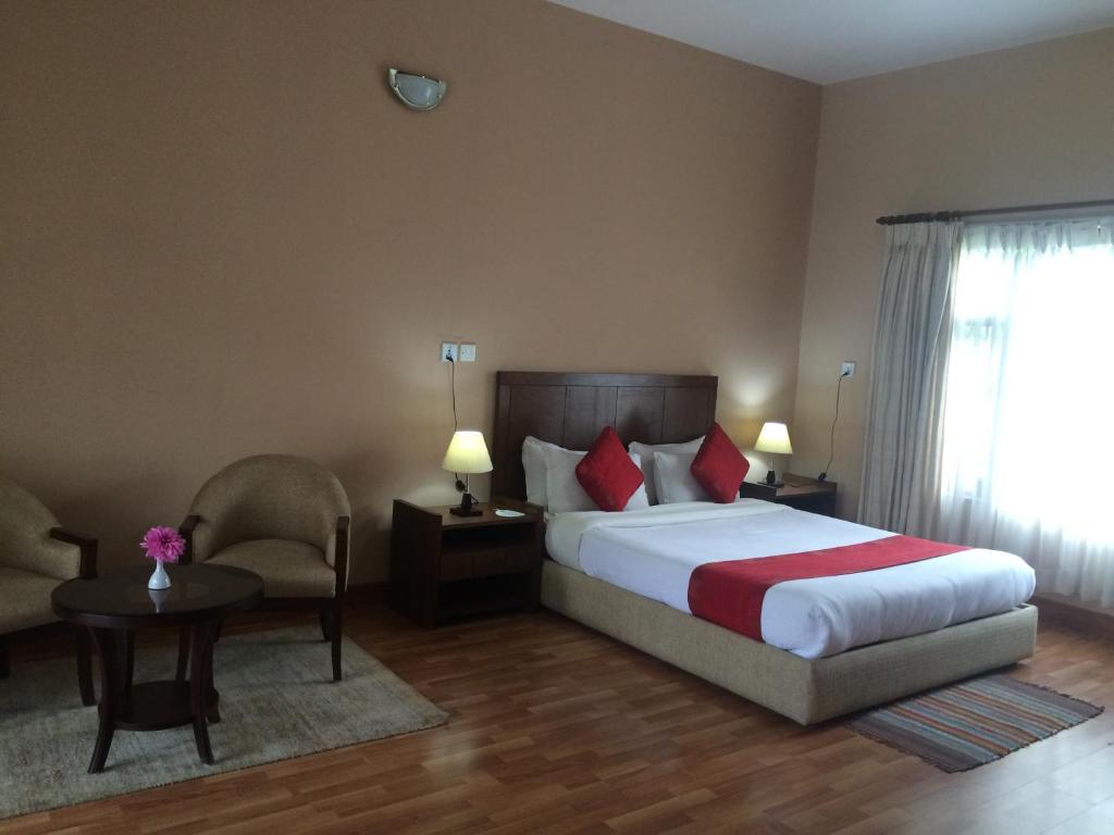Postel nebo postele na pokoji v ubytování ROKPA Guest House