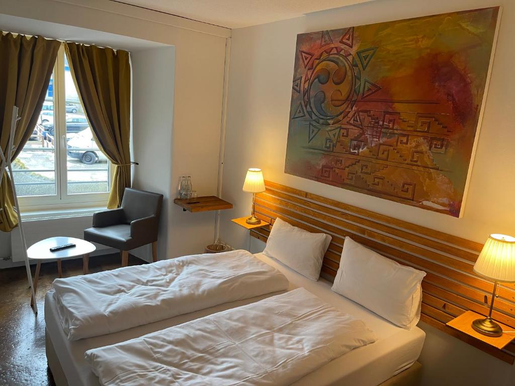 Postel nebo postele na pokoji v ubytování Hotel Swiss Bellevue Aathal