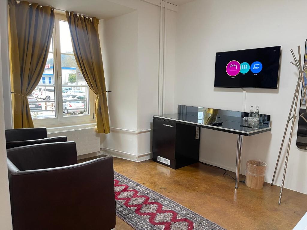 TV a/nebo společenská místnost v ubytování Hotel Swiss Bellevue Aathal