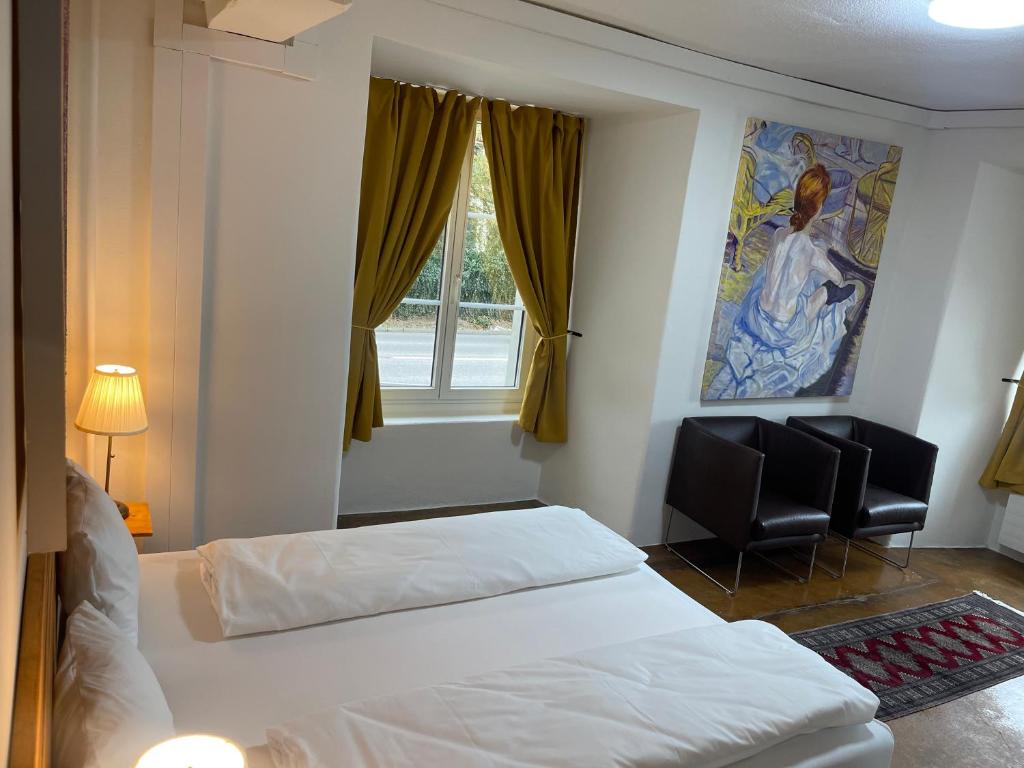 Postel nebo postele na pokoji v ubytování Hotel Swiss Bellevue Aathal