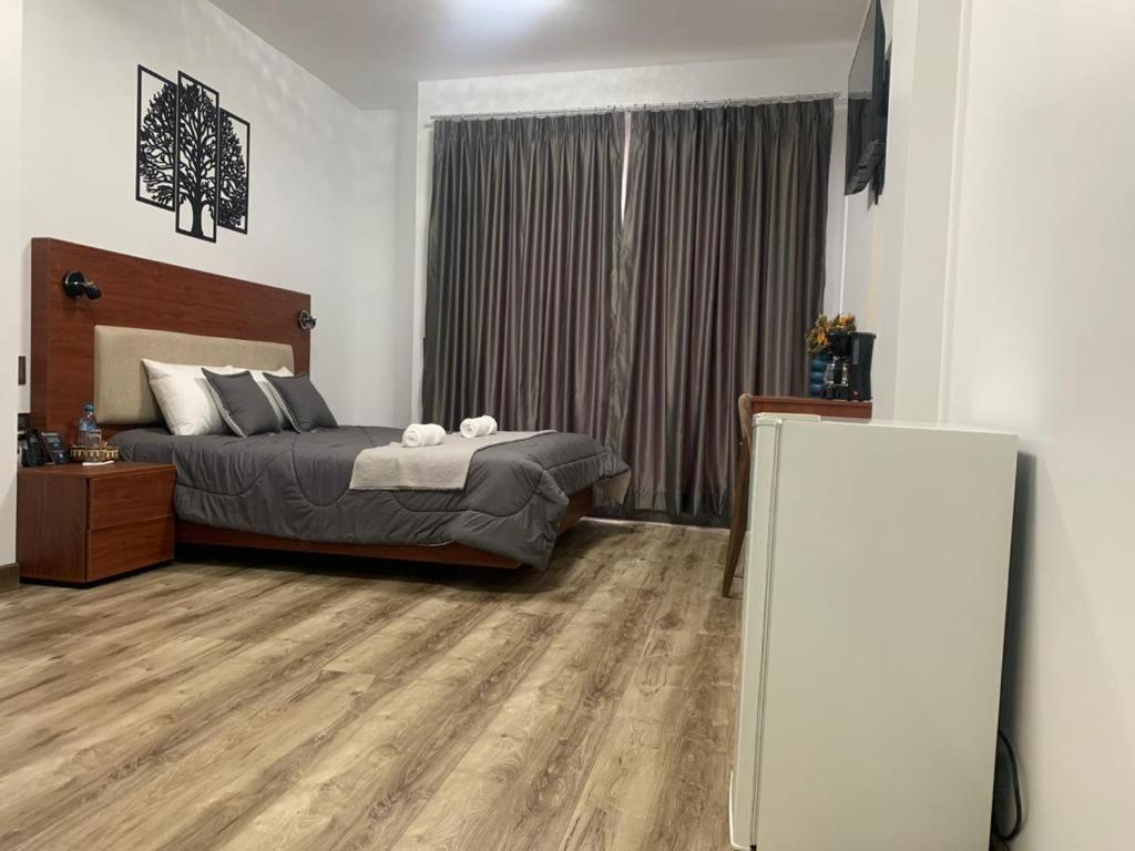 Postel nebo postele na pokoji v ubytování Hotel Sacha Golden