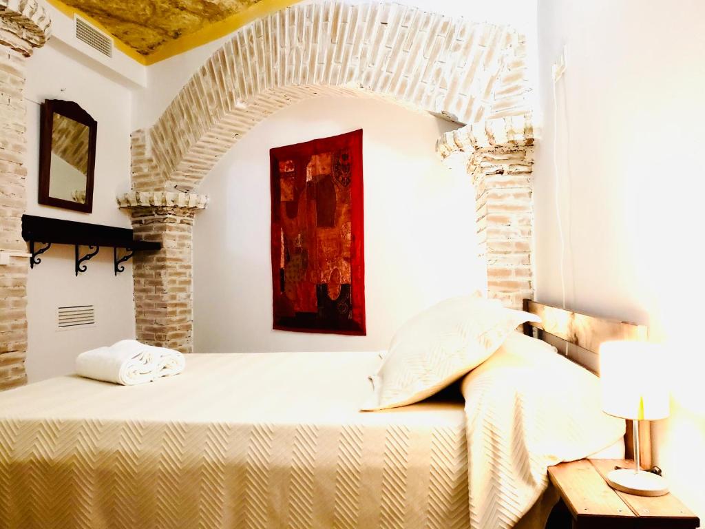 Postel nebo postele na pokoji v ubytování Casa rural cueva El Nido