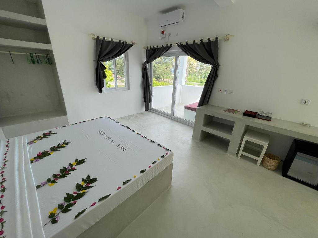 Postel nebo postele na pokoji v ubytování Watamu Ascot Resort